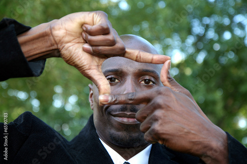 Photo: Businessman Looking through window Businessman Looking through window
