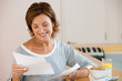 A woman reading a letter