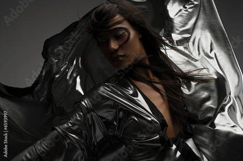 Portrait of a woman wearing silver dress
