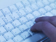 Working on computer keyboard