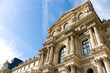 Louvre building on blue sky background