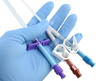 gloved hand holding a catheter and introducer gloved hand holding a catheter and introducer