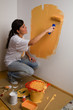 Woman colours her first flat