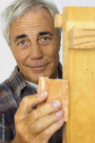 Man sanding wood