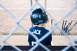 boy in baseball dugout