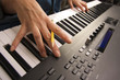Woman's Fingers on Digital Piano Keys Woman's Fingers on Digital Piano Keys