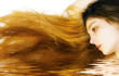 Beautiful long hair reflected in water