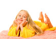 Pretty young girl lying on a bed and dreaming