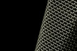 macro of microphone mesh on black