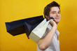  young happy handsome man with presents