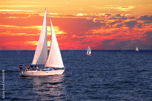 Photo: Sailboats at sunset Sailboats at sunset