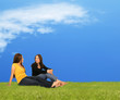 Two Girls Relaxing On Grass