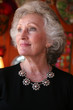 Elegant mature woman with grey hair and beautiful silver jewelry