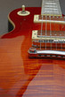 Bridge focus on a Les Paul guitar body Bridge focus on a Les Paul guitar body