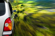 Silver SUV car driving fast through the forest
