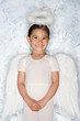 Foto: Girl in an angel costume Girl in an angel costume