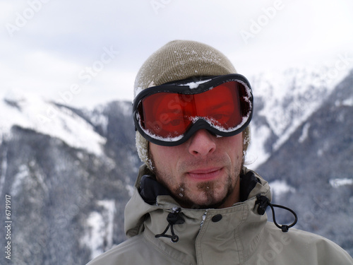 Photo: The snowy face of a snowboarder guy. The snowy face of a snowboarder guy.