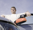 man at his car