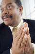 Close up of a man praying.