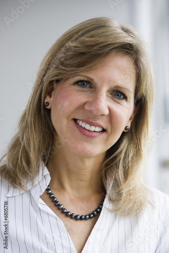 Photo: Portrait of a mid adult business woman. Portrait of a mid adult business woman.