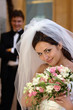 Bride in white wedding dress smiling