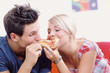 Young couple eating together