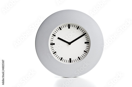 Photo: Modern silve wall clock on a white background Modern silve wall clock on a white background