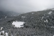 Frozen lake nestled in winter wonderland Frozen lake nestled in winter wonderland