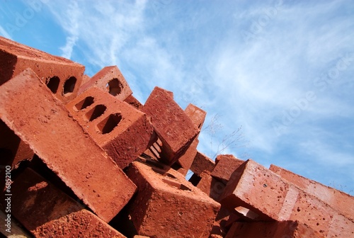 Photo: A stack of bricks at a construction site. A stack of bricks at a construction site.