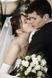 Kissing newlywed couple
