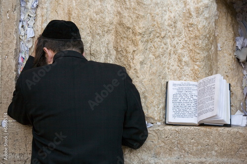 Photo: Praying Jew on Jerusalem Western wall during sabbath Praying Jew on Jerusalem Western wall during sabbath