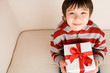 boy holding present