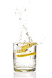 Lemon splashing in martini glass