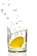 Lemon splashing in martini glass