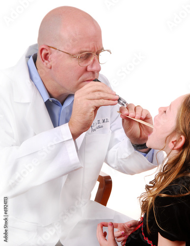 Photo: Doctor Examining Sore Throat Doctor Examining Sore Throat