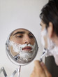 Young man shaving