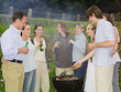 Group of people around barbecue