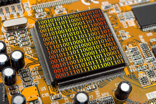 Photo: Computer chip and bytes Computer chip and bytes