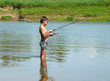 boy fishing with spinning