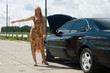 Woman and broken car.