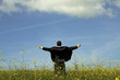 Businessman outstretched on a field