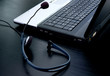 Foto: Laptop computer and headphone with microphone Laptop computer and headphone with microphone