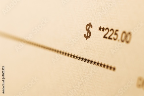 Photo: A check with amount in focus. A check with amount in focus.