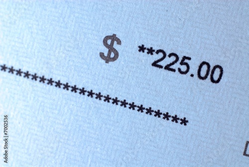 Photo: Paycheck in focus on amount Paycheck in focus on amount