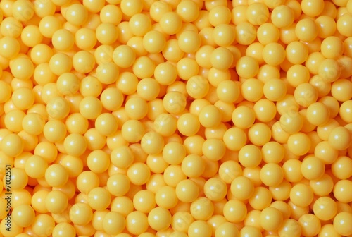 Photo: A pile of yellow round balls. A pile of yellow round balls.