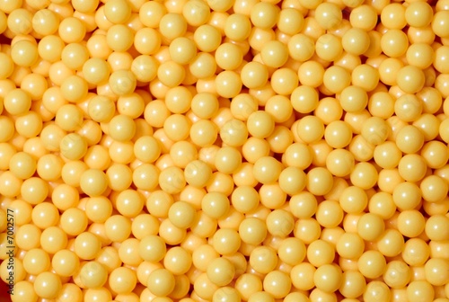Photo: A pile of yellow round balls. A pile of yellow round balls.