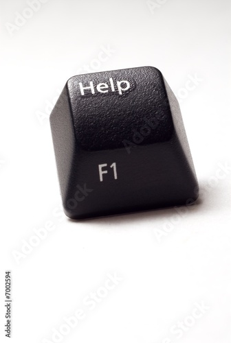 Photo: A black computer keyboard isolated help button. A black computer keyboard isolated help button.