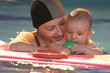 Baby with mother on the swiming pool Baby with mother on the swiming pool