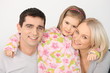 happy young parents with their daughter