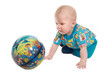 The kid plays with an inflatable ball